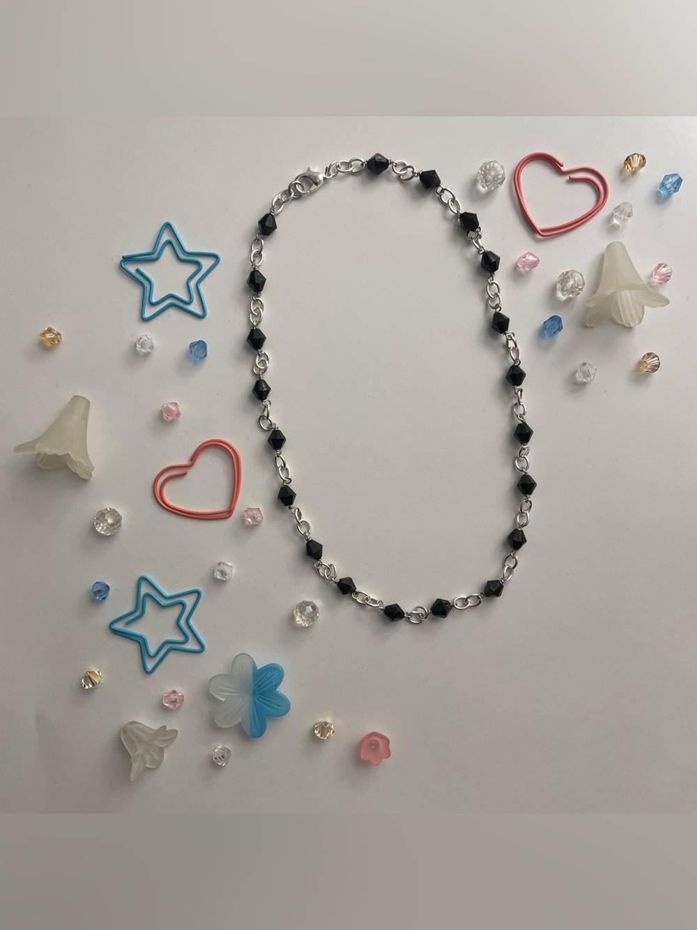 Silver chain necklace with black beads